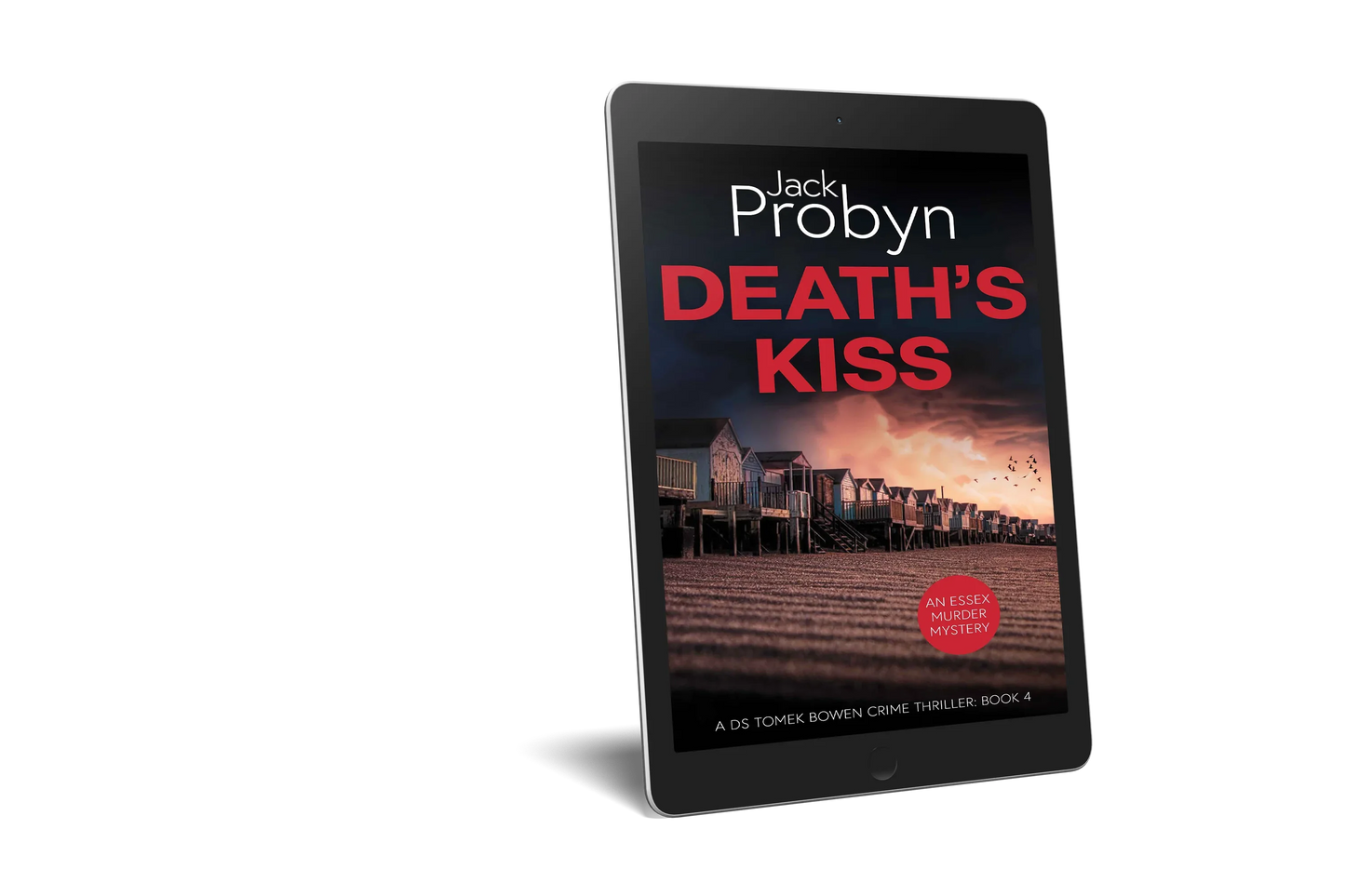 Book cover of Death’s Kiss by Jack Probyn. A gritty Essex Murder Mystery showing a long row of traditional beach huts on a shingle shore at dusk, with birds flying over a pink-hued sky. Book 4 in the DS Tomek Bowen series, perfect for fans of JD Kirk and JM Dalgliesh