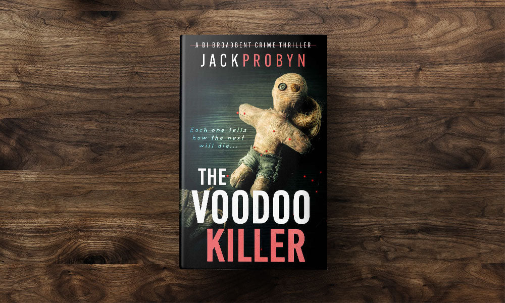 Book cover for The Voodoo Killer, a DI Broadbent crime thriller by Jack Probyn. The image features a weathered, hand-stitched voodoo doll with button eyes and red-tipped pins stuck into its limbs against a dark, textured background